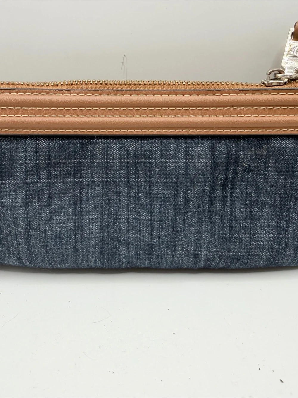 True Religion Denim Wristlet with Tan Trim and Gold Logo